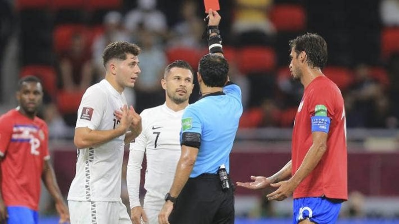 Kosta Barbarouses receives his marching orders after lunging in on Costa Rica’s Francisco Calvo